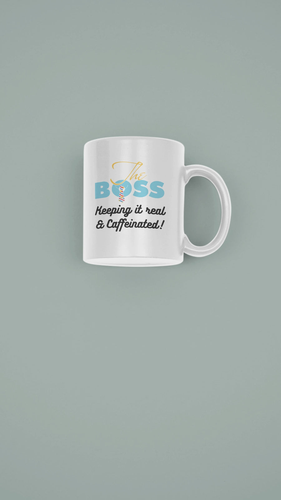 Stylish ceramic mug featuring 'The Boss - Keeping It Real & Caffeinated' in colorful text on a muted background.