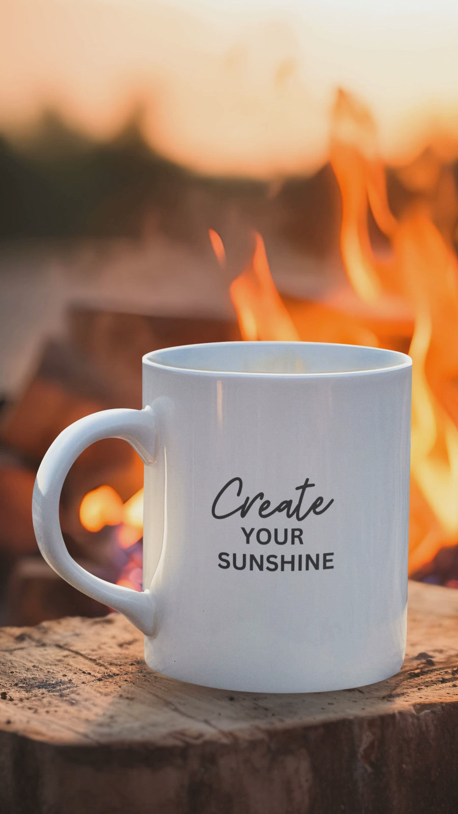 Create Your Sunshine motivational mug on a wooden surface, featuring bold text and a warm campfire background.